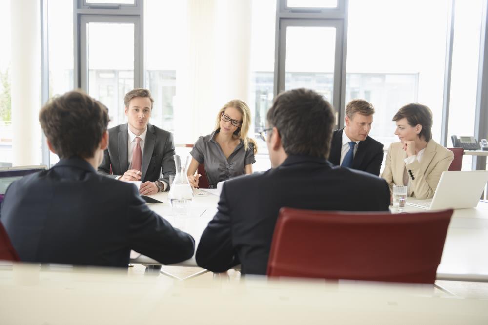 group of people attending a meeting group of people attending a meeting